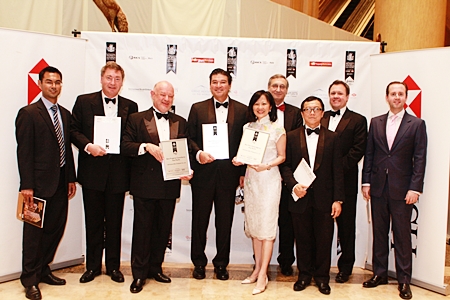 Representatives of CBRE Thailand led by David Simister, 3rd left, are presented with the awards April 27 at the JW Marriott Hotel in Kuala Lumpur, Malaysia.